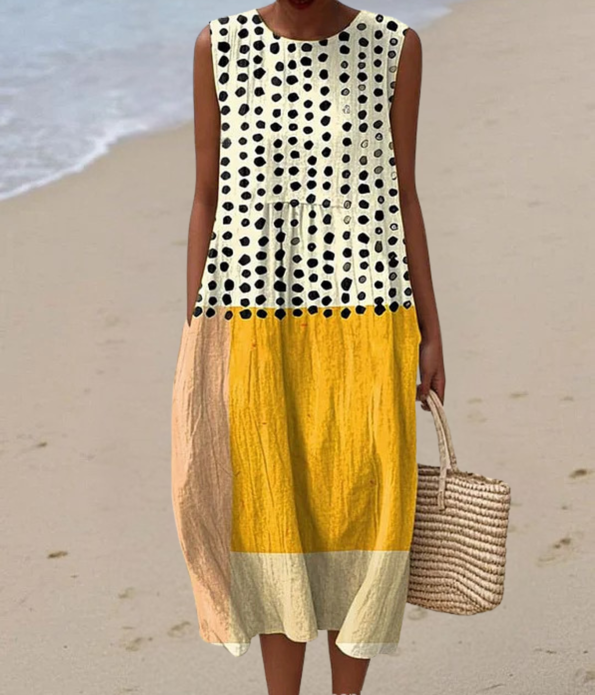 ドット柄のイエローノースリーブロングドレス